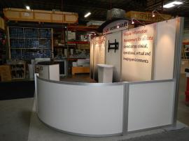 RENTAL:  Modified RE-2021 10' x 20' Rental with RE-1205 Large Curved Counter and Large Monitor Mount -- Image 2