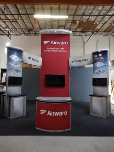 RENTAL: Modified RE-9076 Island Design with (2) Double-Sided Custom Kiosks