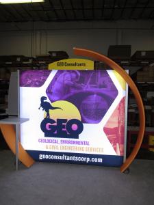 ECO-1072 Sustainable Display with Curved Accents, Workstation Counter, and LED Backlit Graphics