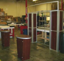 10' x 10' Visionary Designs Display with Tapered Pedestals and a Custom Header